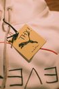 A White Hoodie Sweatshirt With a Tag