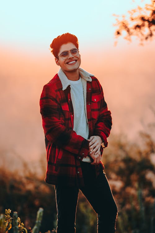 Smiling Man Wearing a Red Plaid Shirt