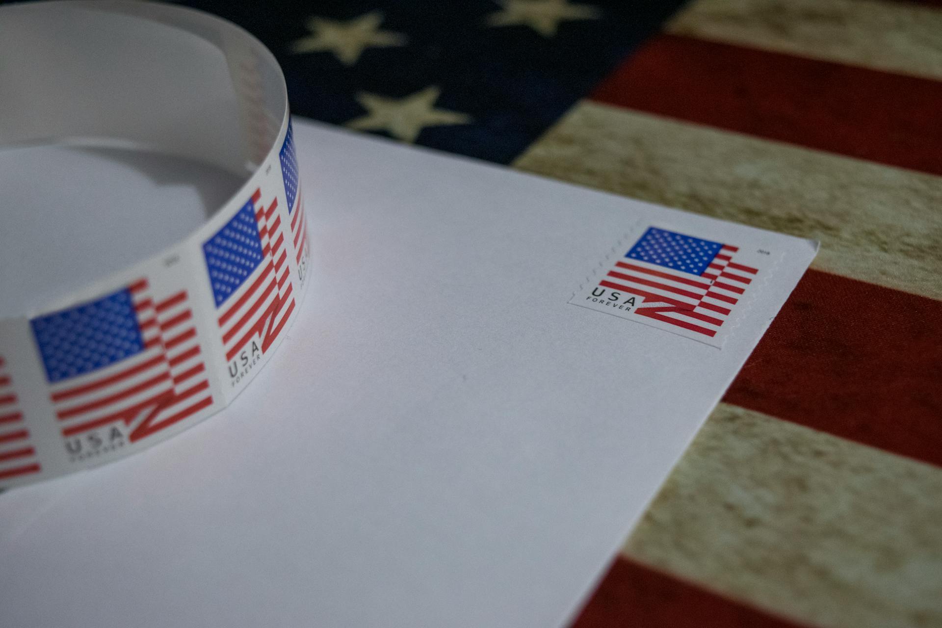 Postage Stamp with USA Flag on White Envelope