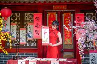 A Woman in a Traditional Clothing Holding a Scroll