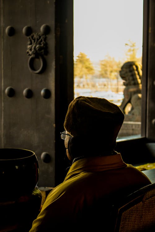 Monk Looking out Temple Window