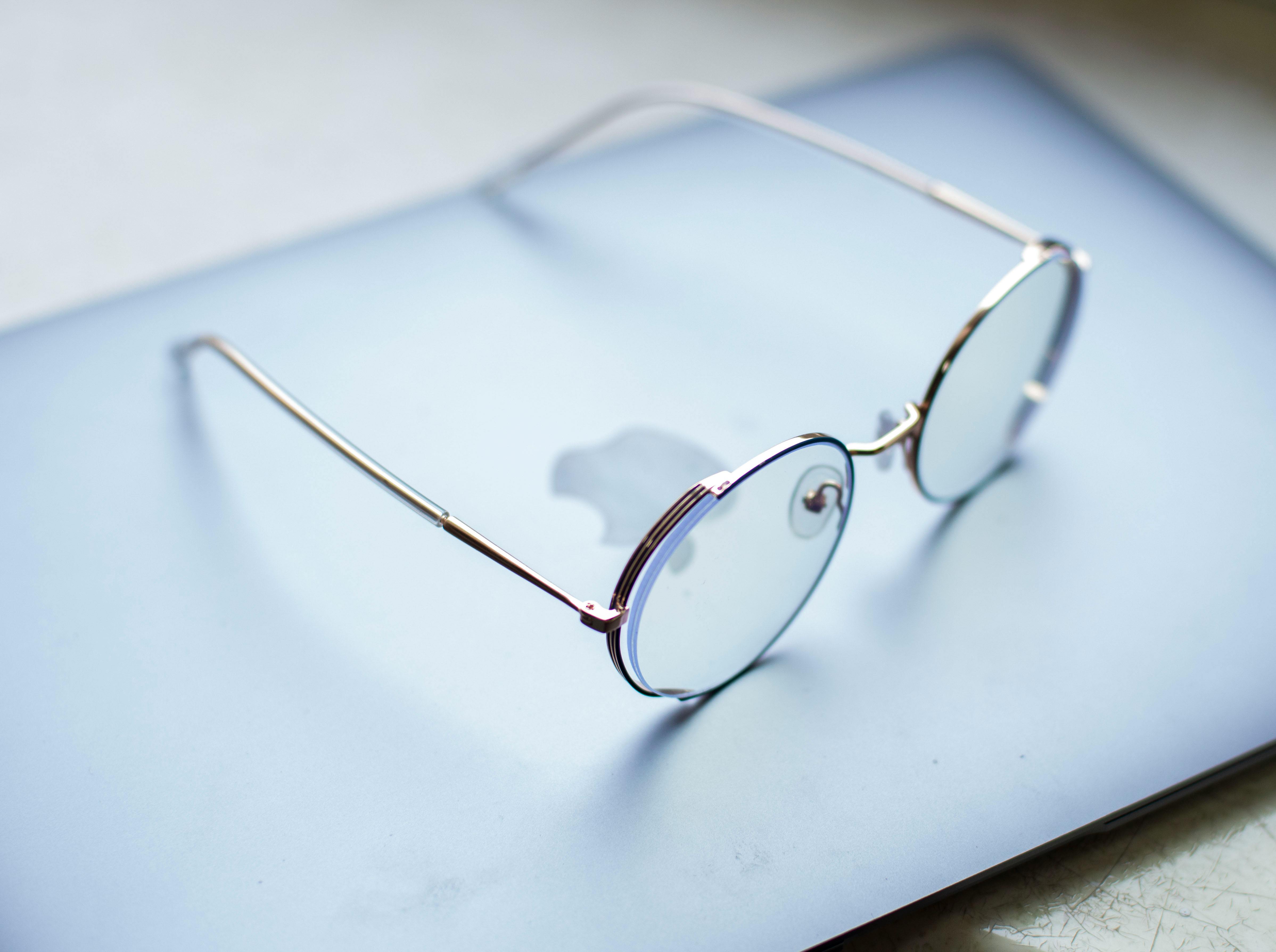 Close-Up Shot of Eyeglasses on a Laptop · Free Stock Photo