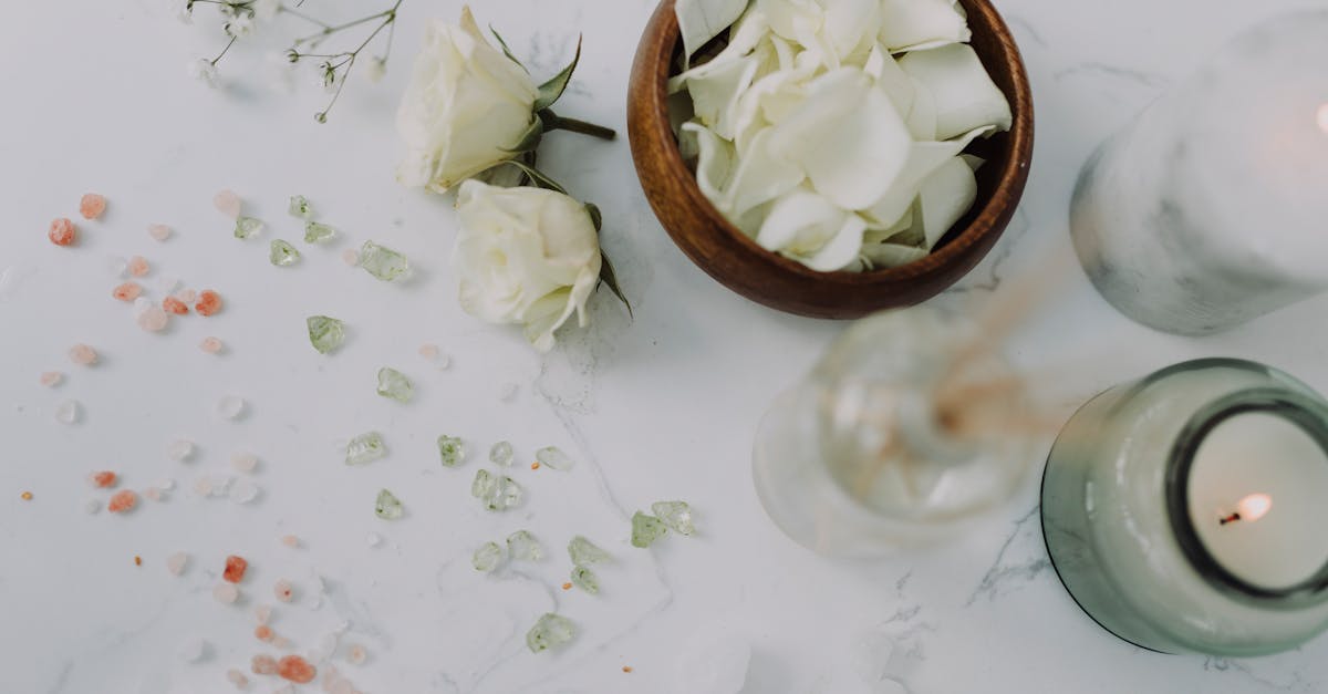 white roses with colored salts around them