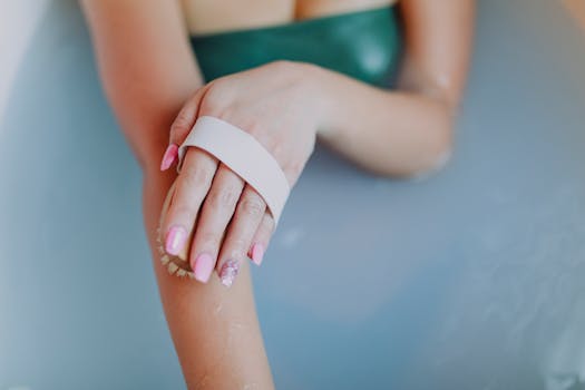 A woman enjoys a relaxing bath, focusing on self-care with a body scrub brush.