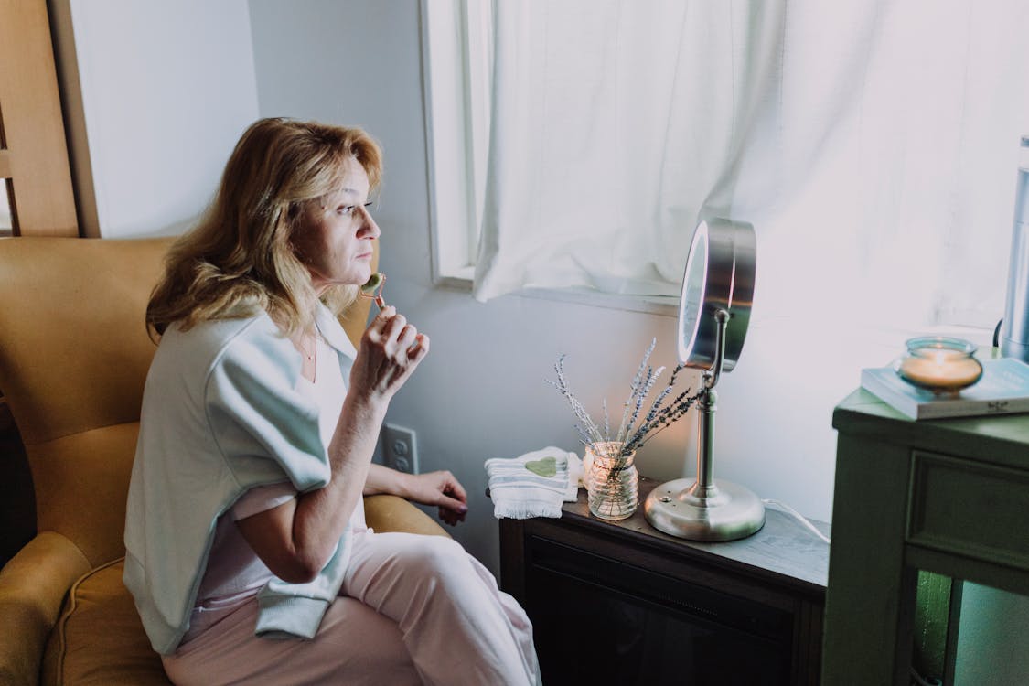 A Woman Massaging Her Face