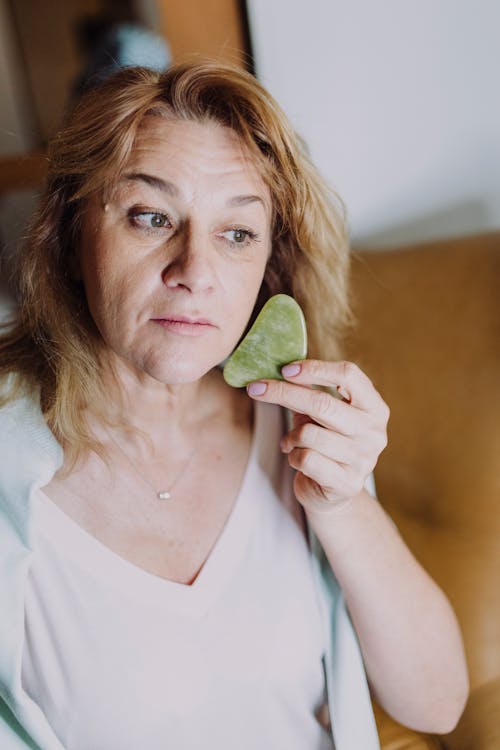 A Woman Using a Gua Sha 