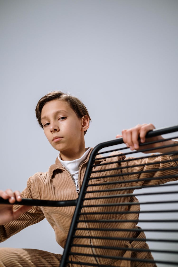 A Person Holding On A Metal Object