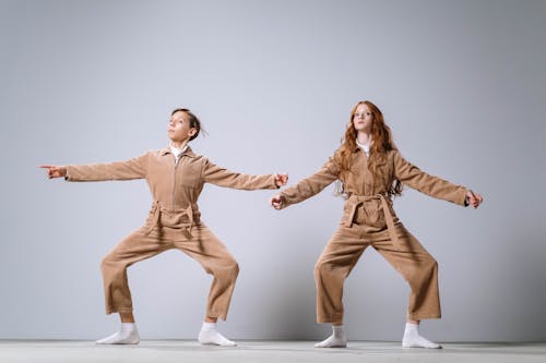 Man and Woman Wearing Brown Overalls