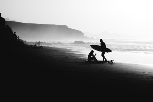surfer beach sunset