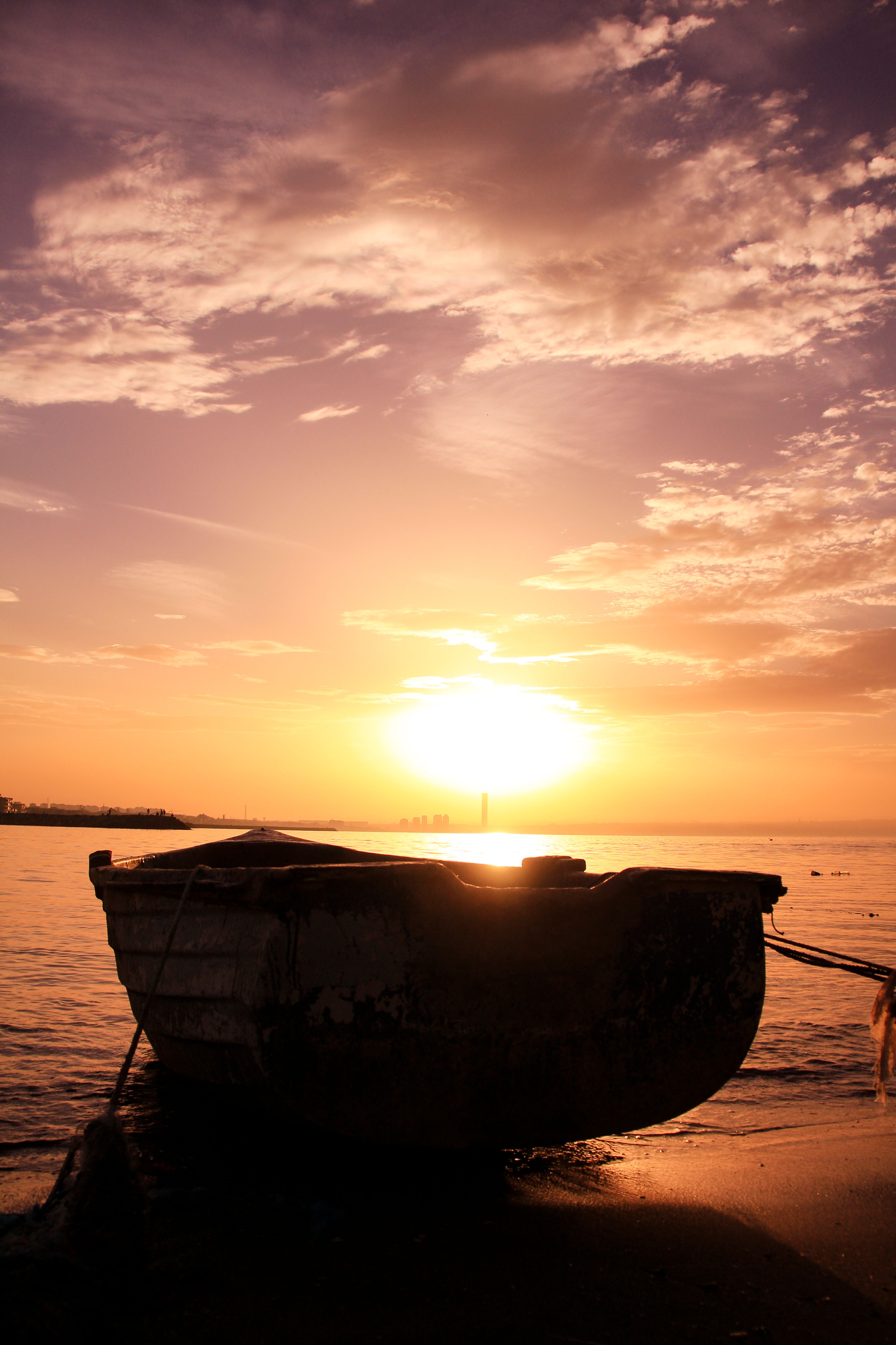 Brown Wooden Boat on Shore during Sunset · Free Stock Photo