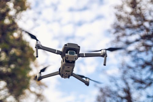 Free Black and White Drone Flying in the Sky Stock Photo