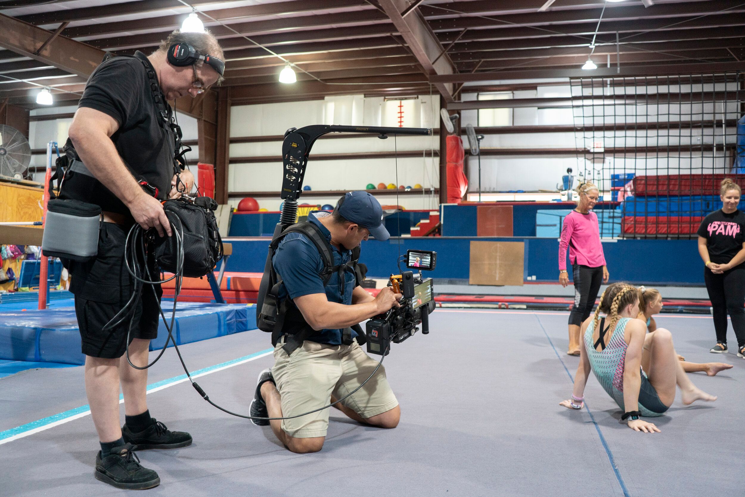 Professional video production team filming corporate content