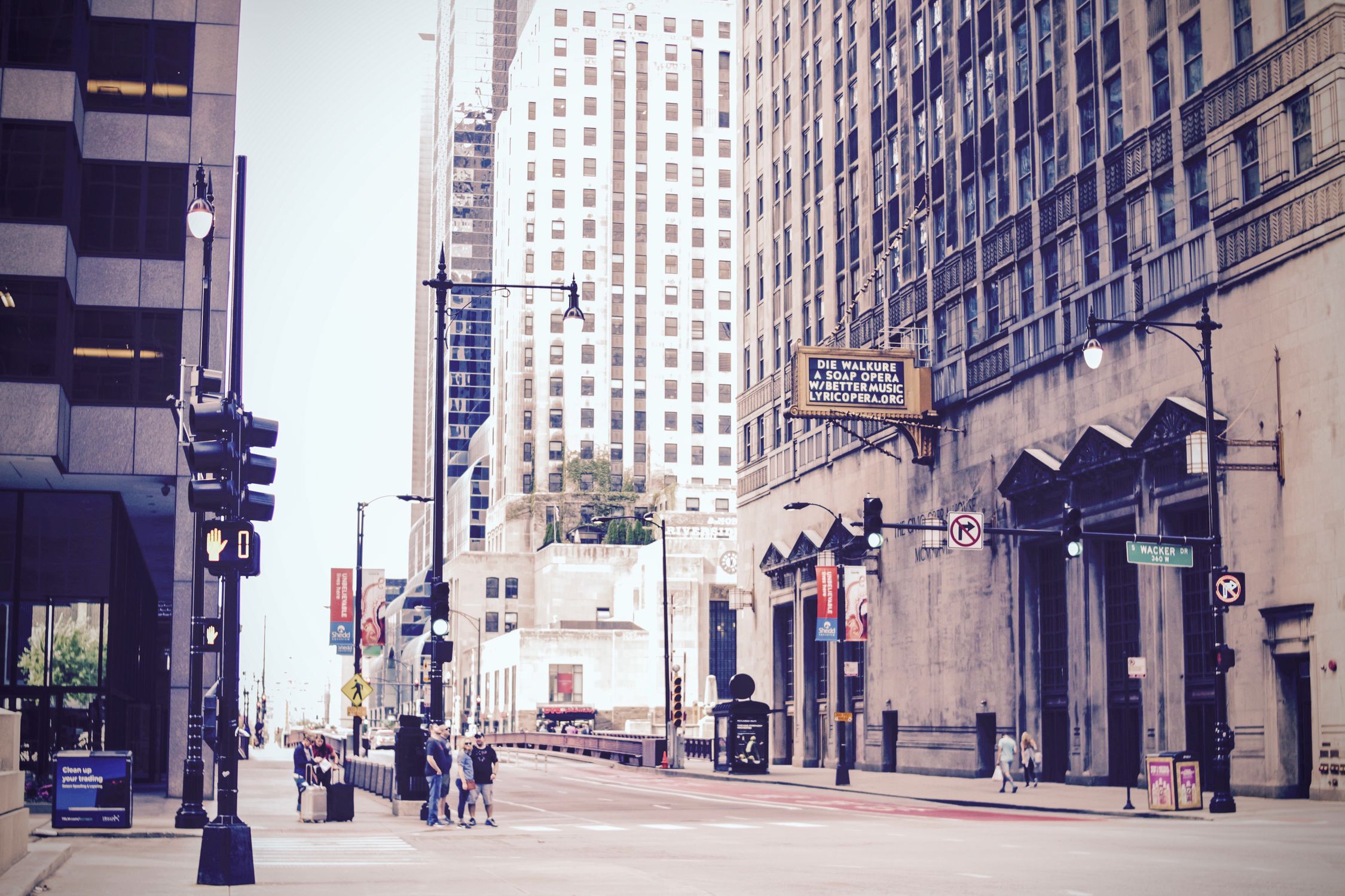 Dynamic urban street scene in downtown Chicago featuring iconic skyscrapers and bustling city life.