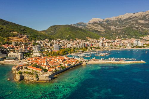 Free Explore Budva, Montenegro's stunning coastal cityscape, showcasing historic architecture and vibrant waterfront views. Stock Photo