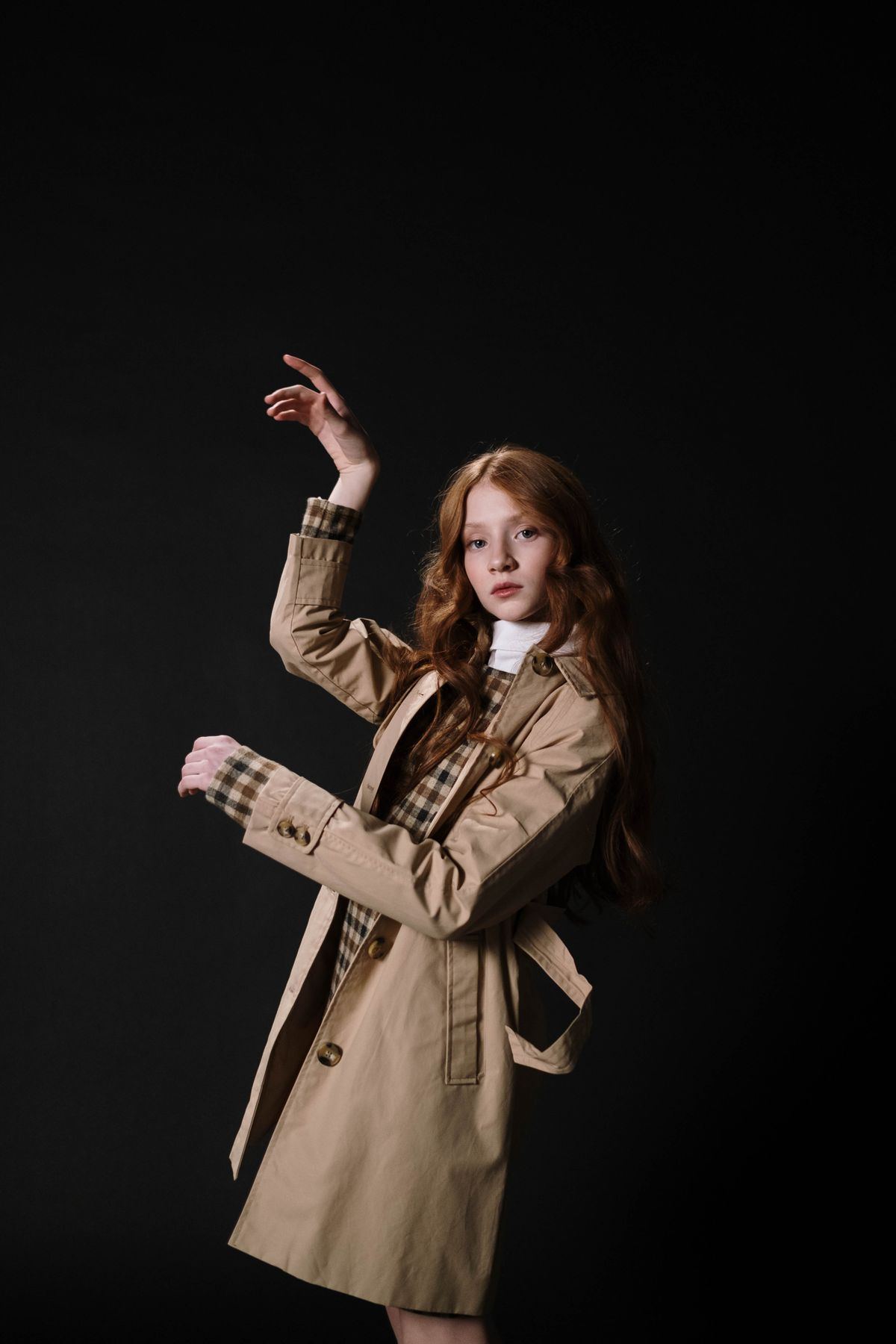 A woman in a beige trench coat — the classic camel trench