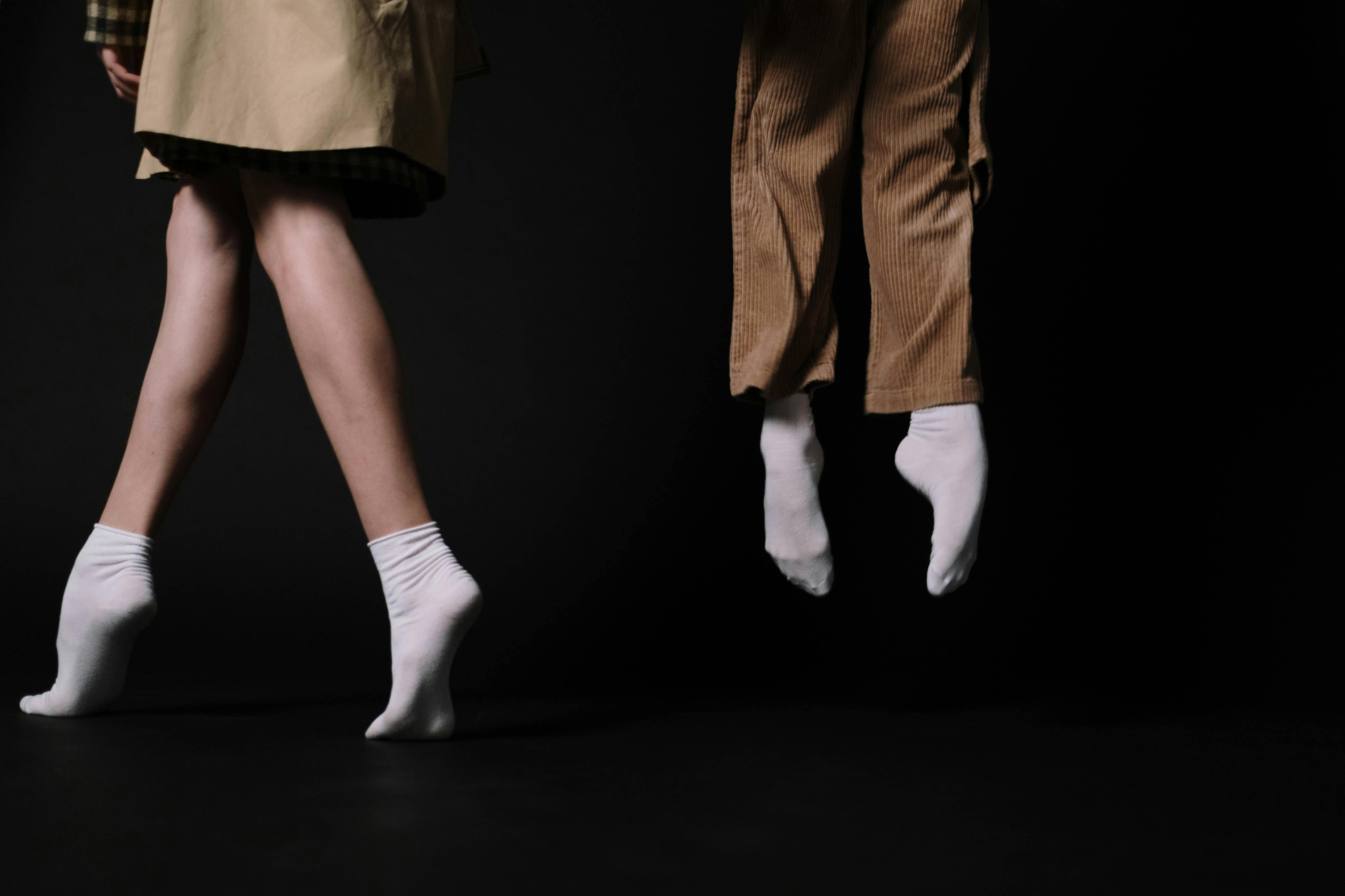 close up of the feet on a woman and a man