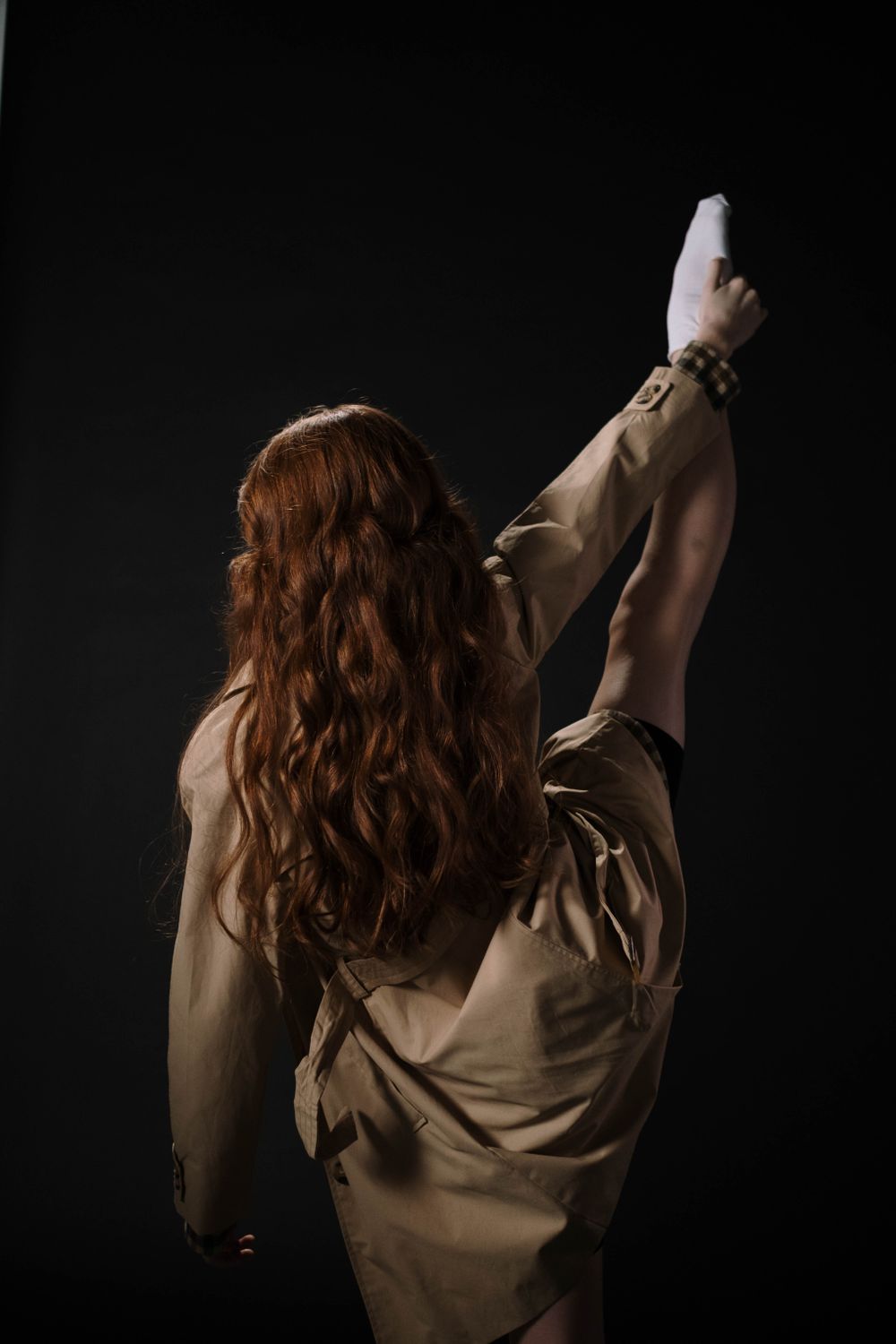 Back View of a Girl Wearing a Brown Coat While Dancing · Free Stock Photo