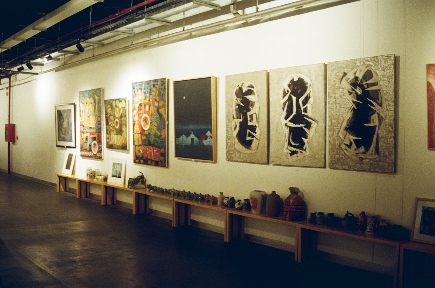 Explore a vibrant art exhibit in an indoor gallery showcasing modern pieces in Hồ Chí Minh City.