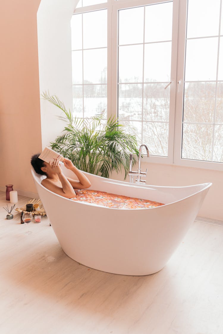 Woman Relaxing In A Flower Bath