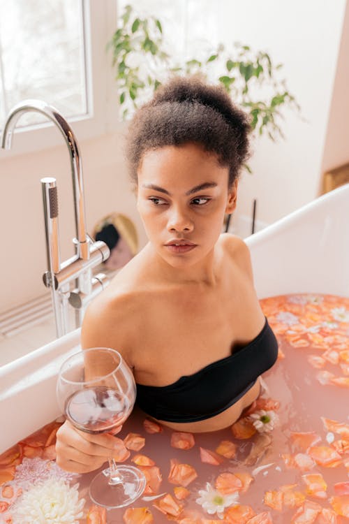 Free Woman Relaxing in a Flower Bath Stock Photo