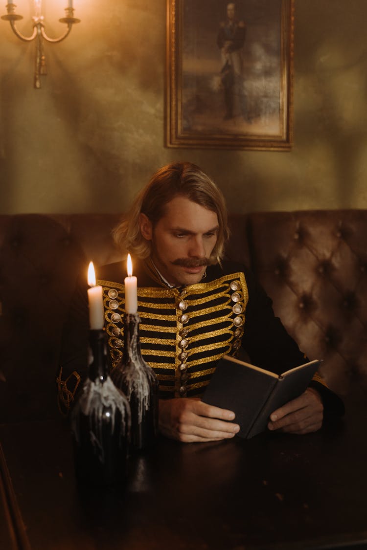 A Man Reading A Book