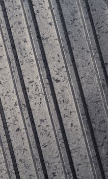 Close-up of vertical steel surface showcasing detailed texture and speckles.