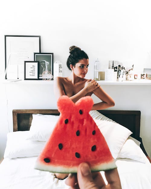Woman covered in a Slice of Wataermelon
