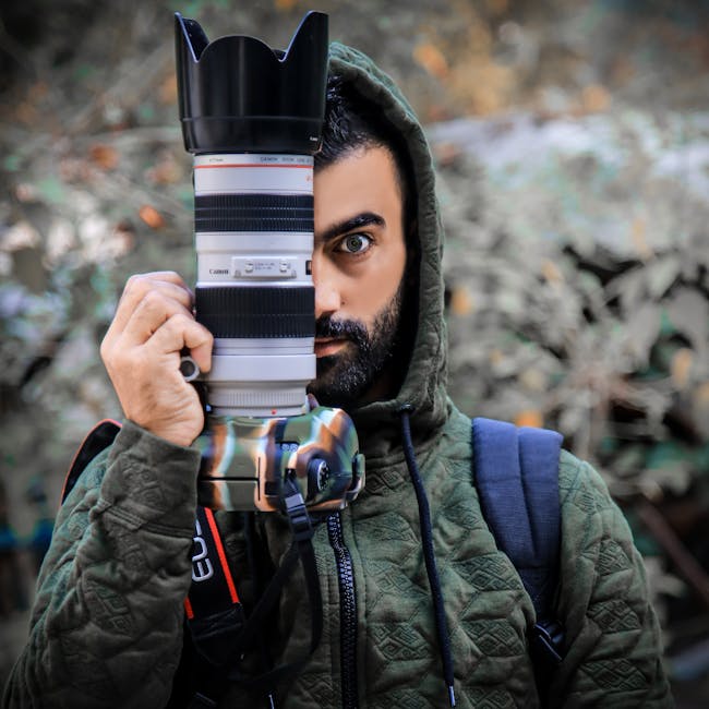 Person Holding a Dslr Camera · Free Stock Photo