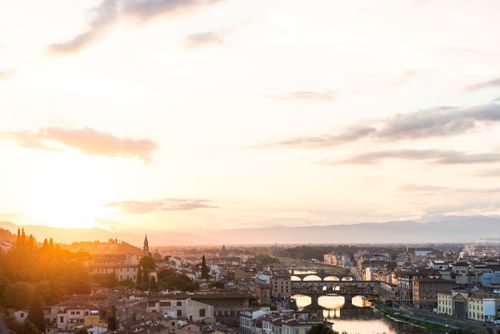 Free Beautiful view of Florence skyline with iconic bridges and sunrise lighting. Stock Photo