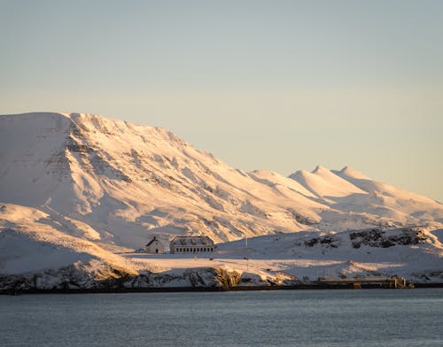 Snow Covered Mountain Near the Lake