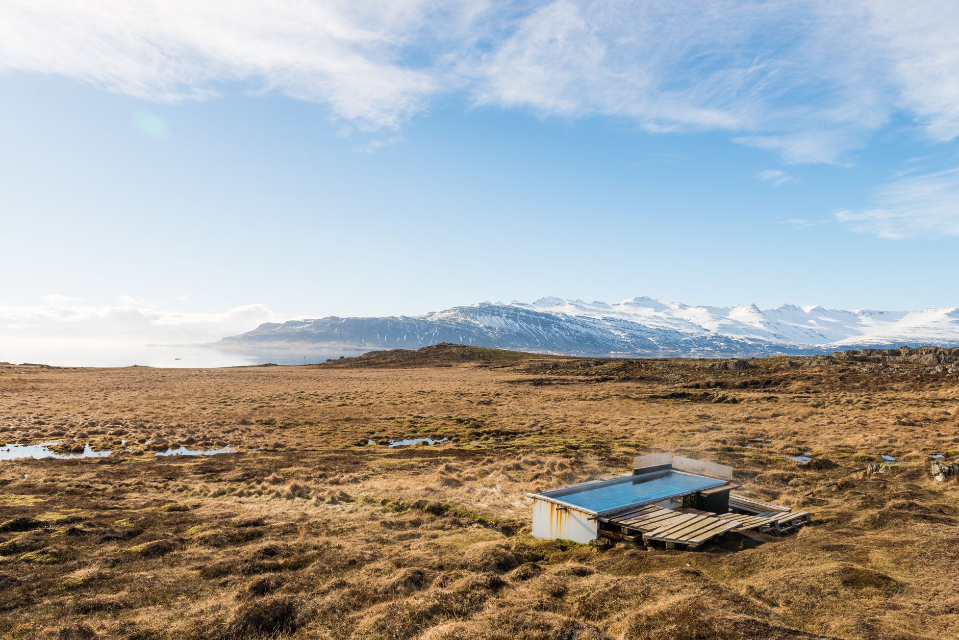 Steaming outdoor geothermal pool at an Icelandic hotel at dusk