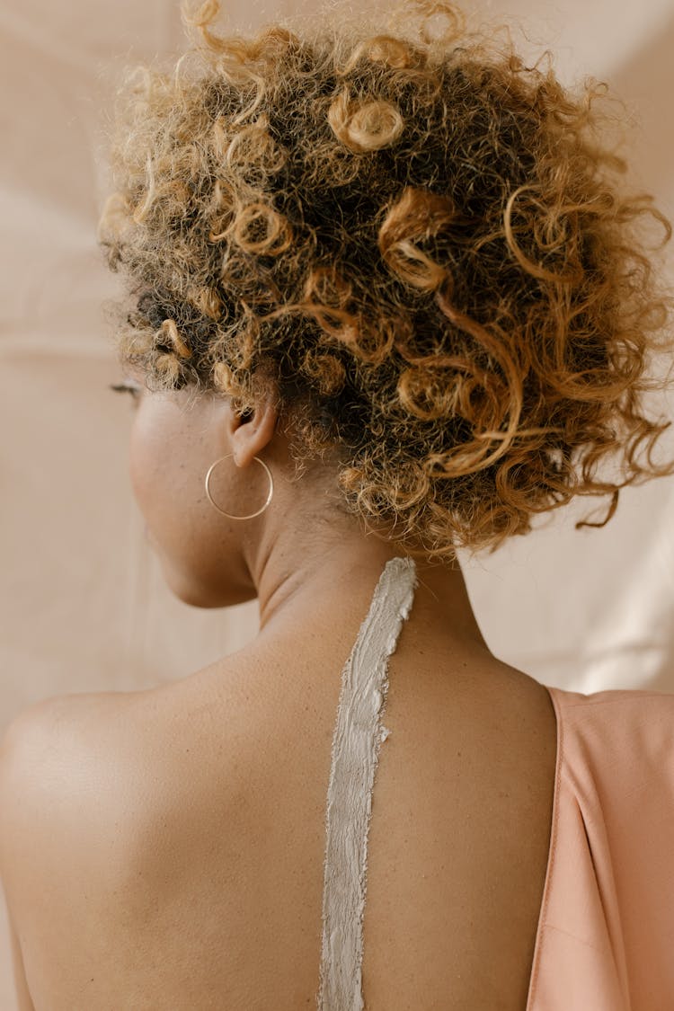 Back View Photo Of Woman With Curly Hair