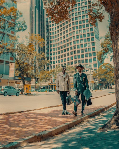 Men Wearing Suit on a Sidewalk