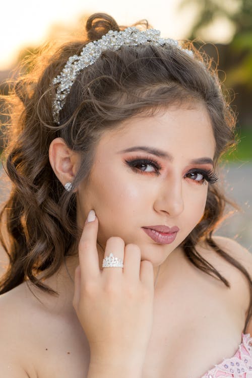 Woman With Silver Tiara and Silver Ring