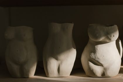 Hands shaping dark clay in a studio — cottonbro studio on Pexels