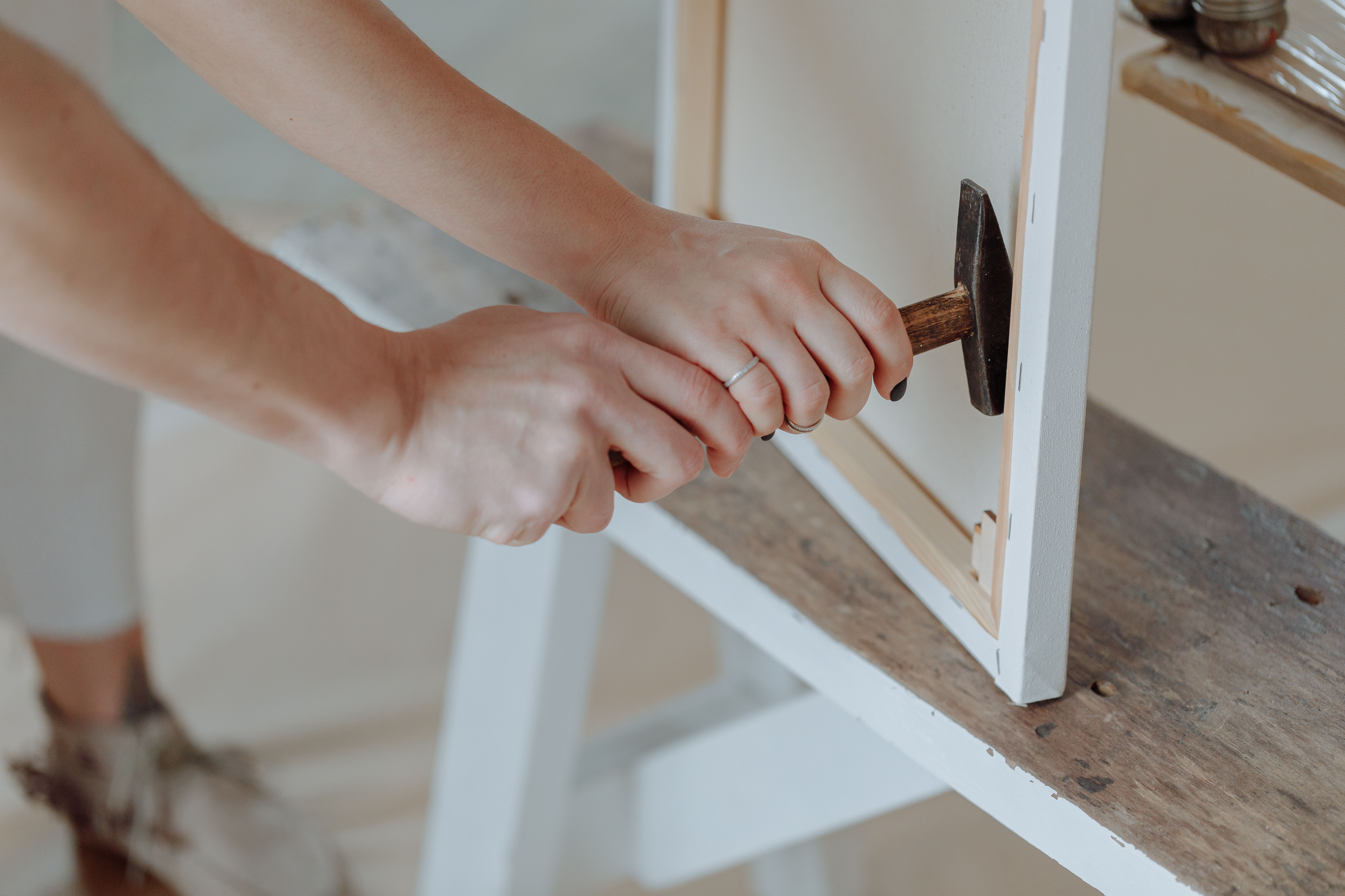 Professional assembling furniture with tools and equipment