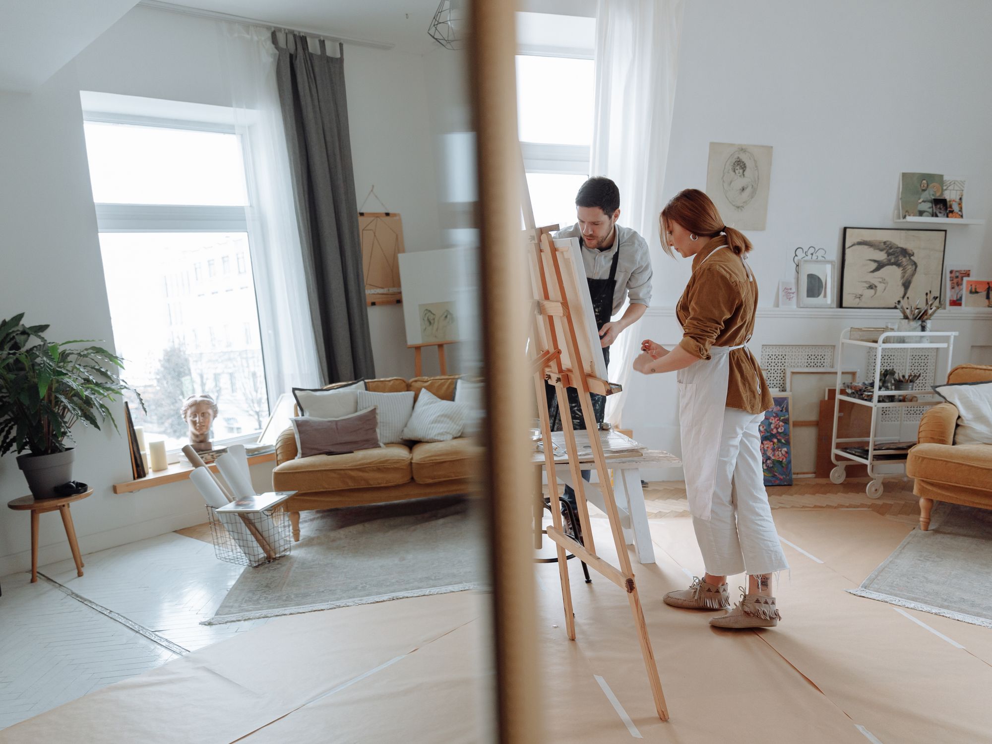 Painters & Decorators in Southwark, London — professional decorator painting a wall with a roller