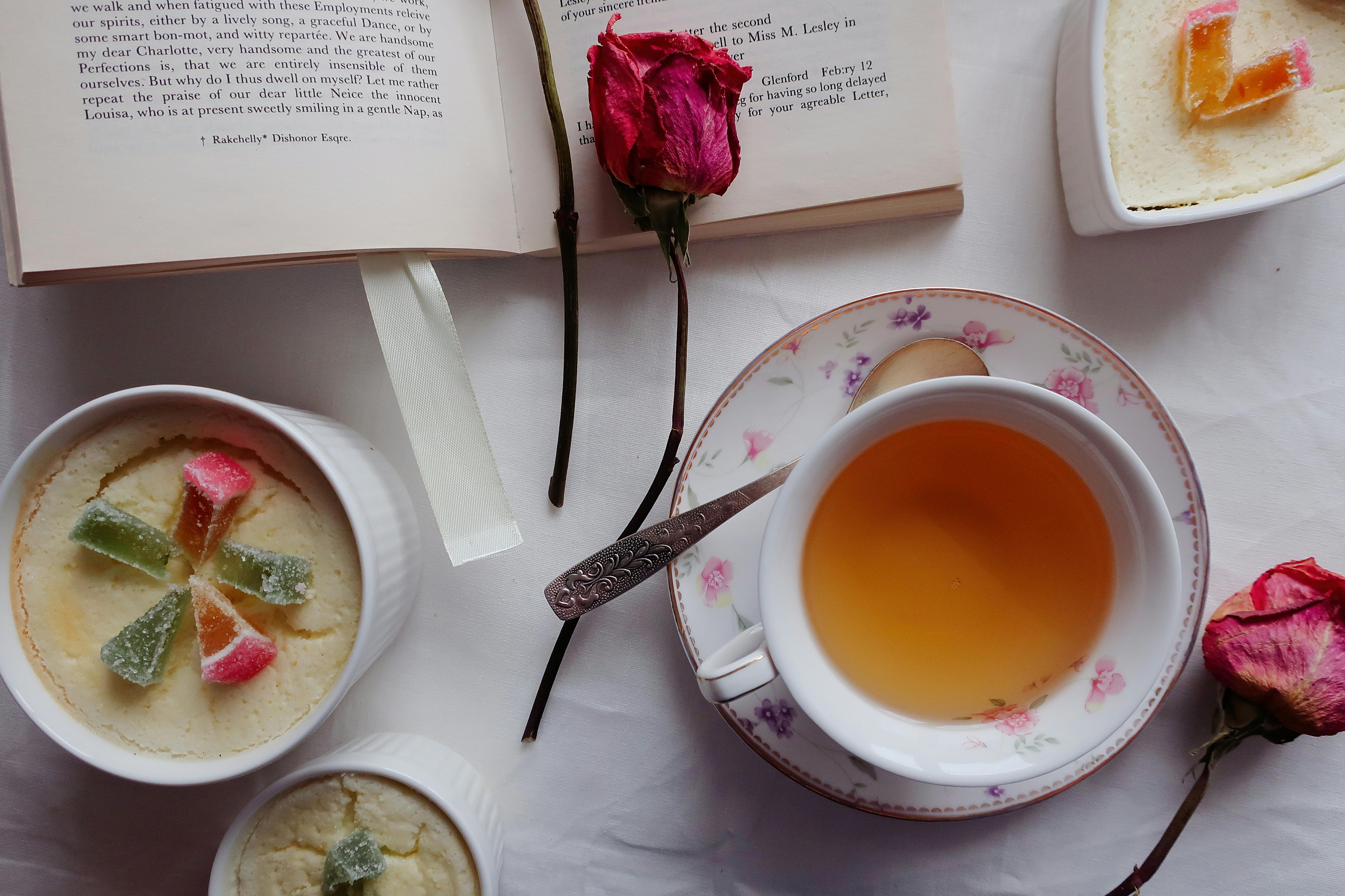 A Cup of Tea Near an Open Book · Free Stock Photo
