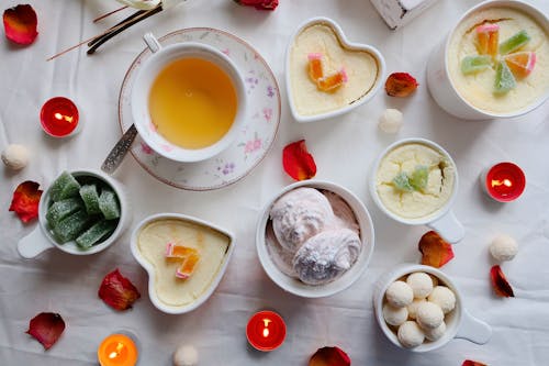 tea and Sweet Desserts on White Surface