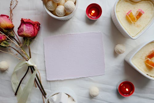 Blank White Paper Surrounded with White Ramekins 