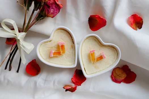 Delightful heart-shaped desserts with roses and petals, perfect for Valentine's Day.