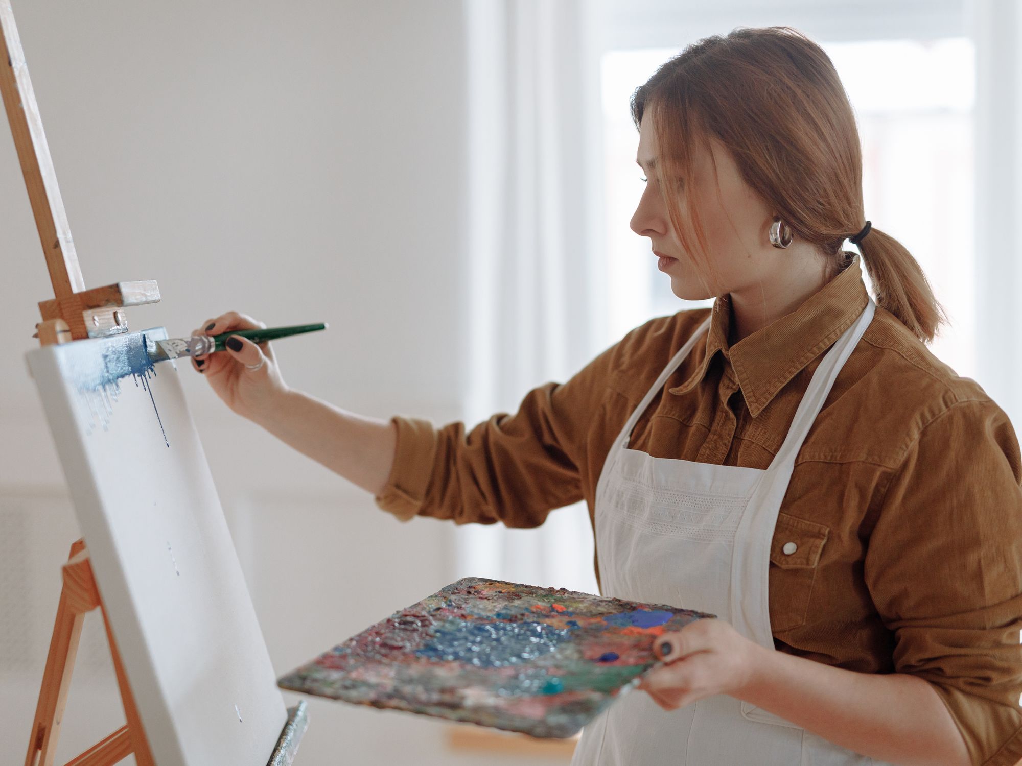 Masonry and Render Painting in Wanstead, Redbridge — professional painter and decorator at work