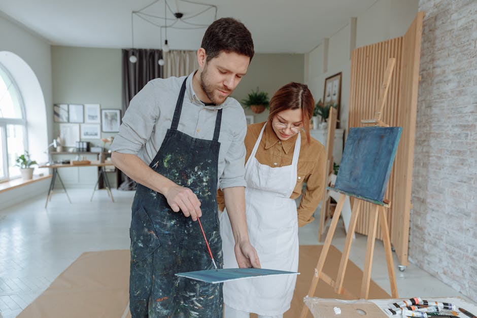 Stop Indoor Cat Weight Gain — Try Active Enrichment Man and woman painting in a studio, sharing creative ideas and enjoying an art lesson together.