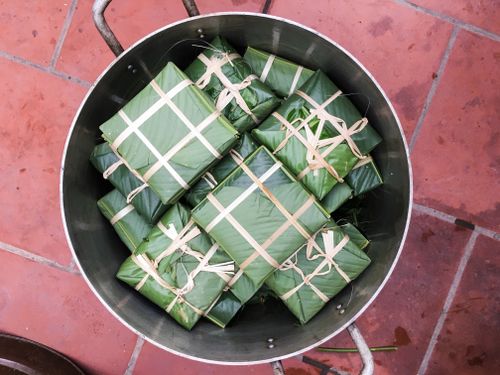 Free Top view of Bánh Chưng wrapped in banana leaves, a Vietnamese traditional dish. Stock Photo