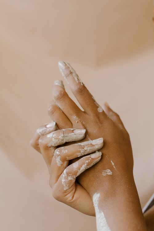 Free Close-up of hands engaged in artistic clay working, emphasizing the creative process. Stock Photo