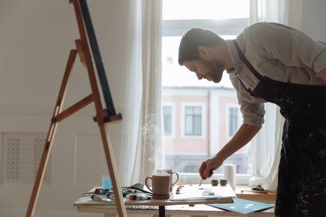 Artist painting in a bright studio — photo by Thirdman on Pexels
