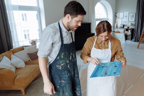 A Man and a Woman Painting