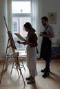 Painters looking at a Painting