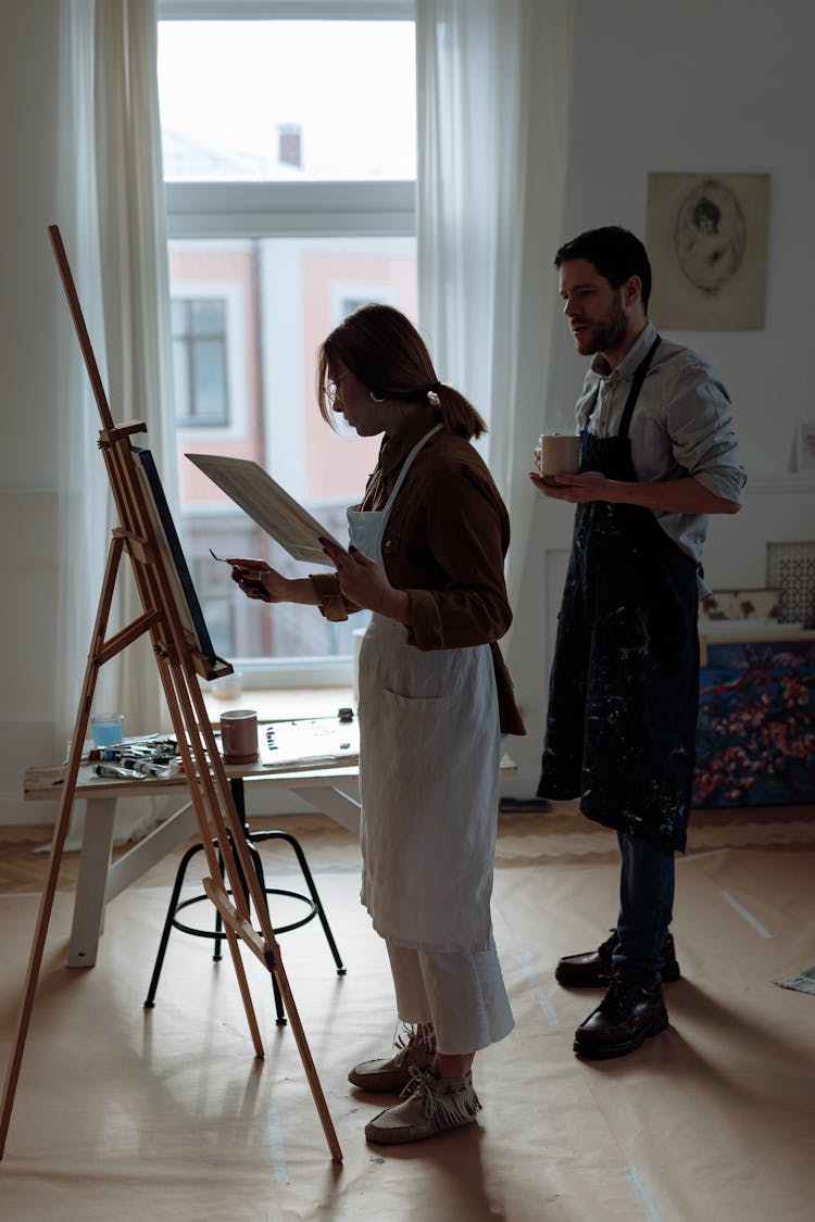 Painters Looking At A Painting