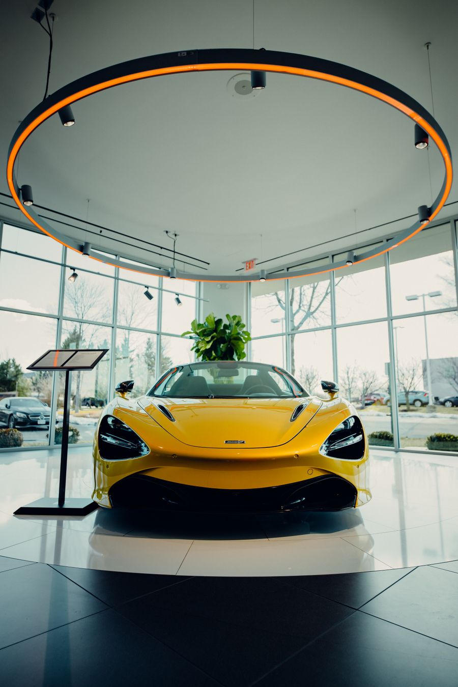 Porsche 911 Carrera, yellow sports car on display